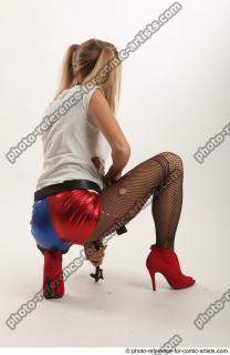 Nikol Squatting Pose With Gun